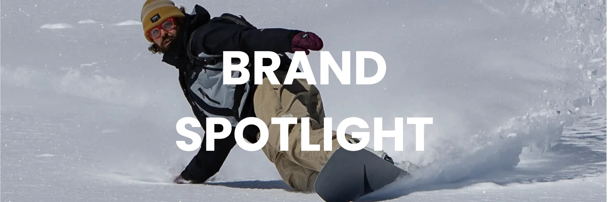 Person snowboarding in the snow with 'Brand Spotlight' text overlay