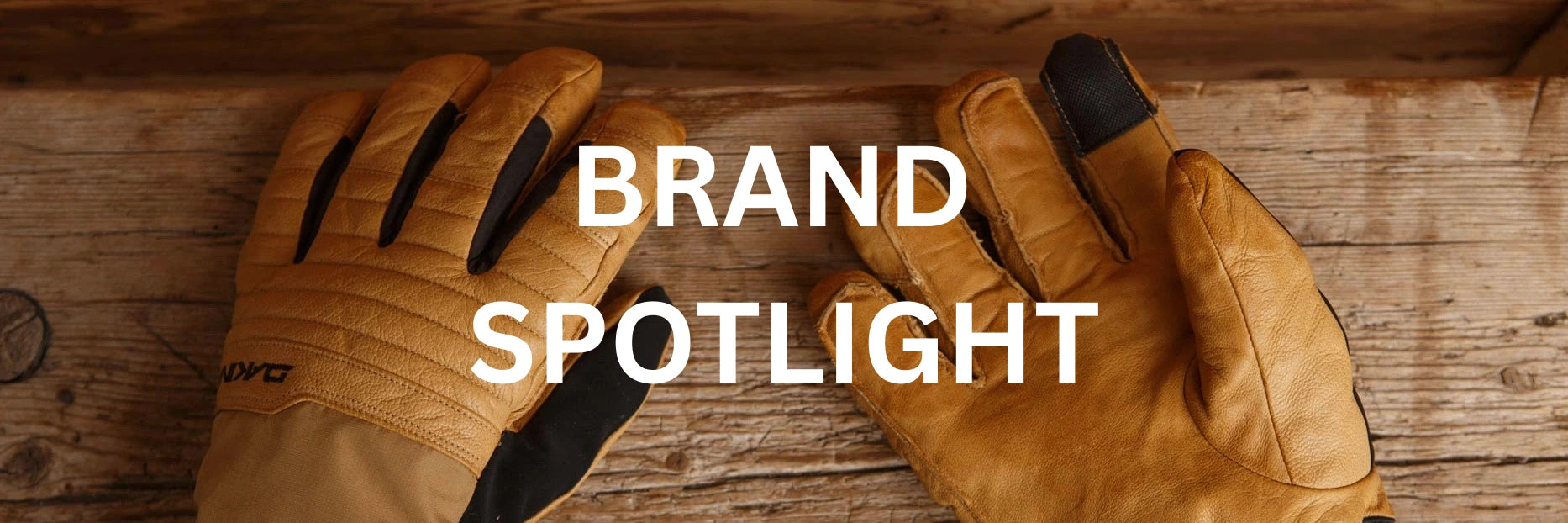 Pair of brown leather gloves on a wooden surface with 'Brand Spotlight' text overlay.