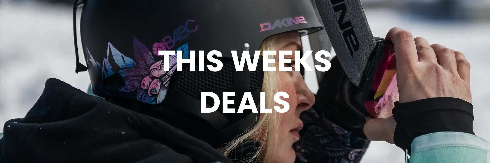 Person wearing a helmet with a focus on 'This Week's Deals' text overlay